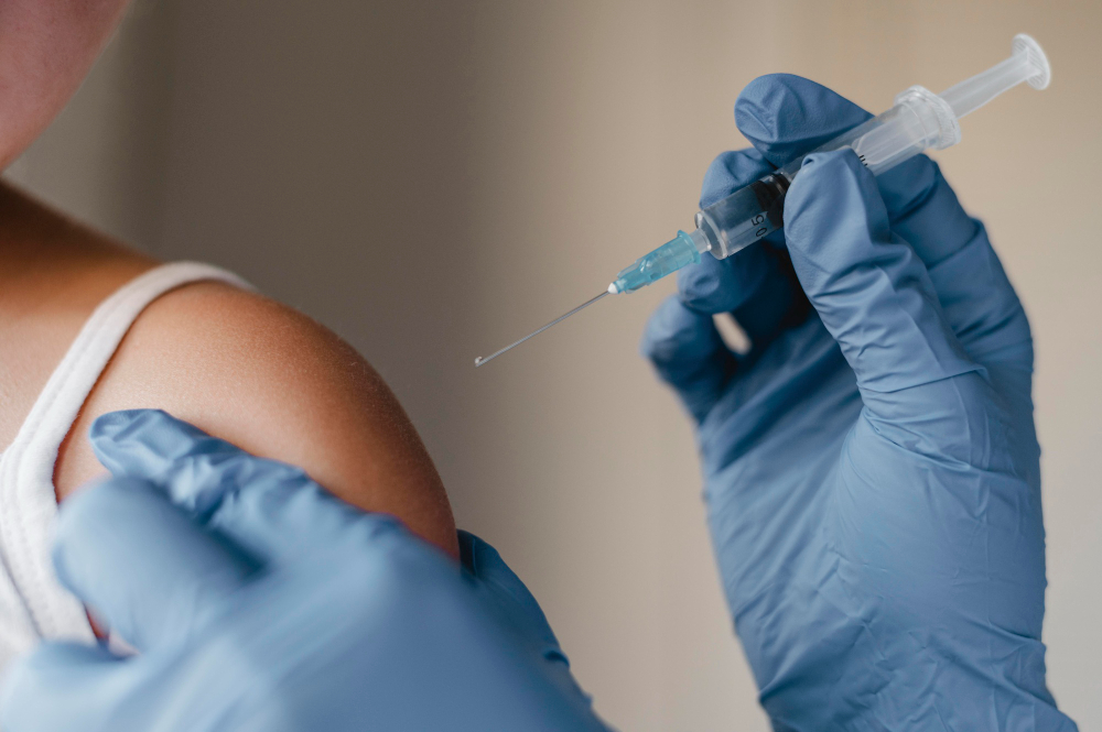 Pharmacist giving flu and COVID vaccines at CityMed Pharmacy White Rock & Surrey